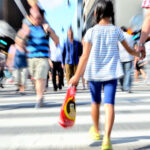 Kid Safety Tips - mom walking holding dauther's hand